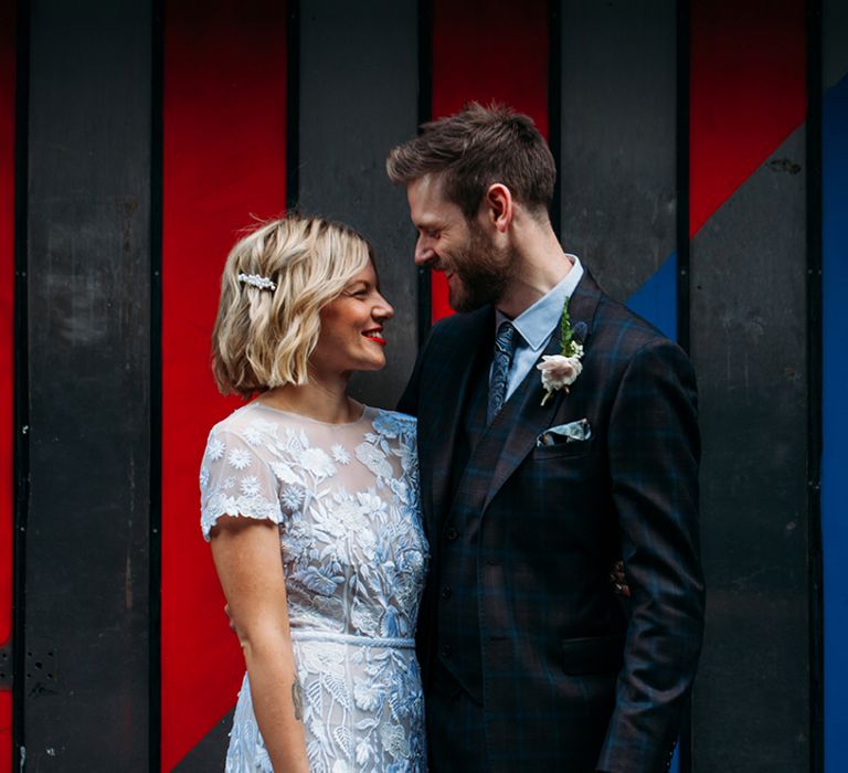 Bride in Lace Hermione De Paula Wedding Dress and Groom in Ted Baker Suit