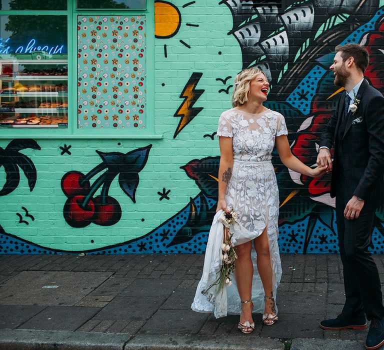 Bride in Lace Hermione De Paula Wedding Dress and Groom in Ted Baker  Laughing Together