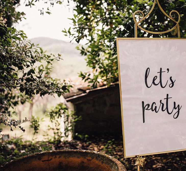 Let's Party Wedding Sign in Gold Frame | Stylish Tuscan Wedding at Vignamaggio Planned by The Wedding Boutique Italy | Samuel Docker Photography | Paul Vann Films