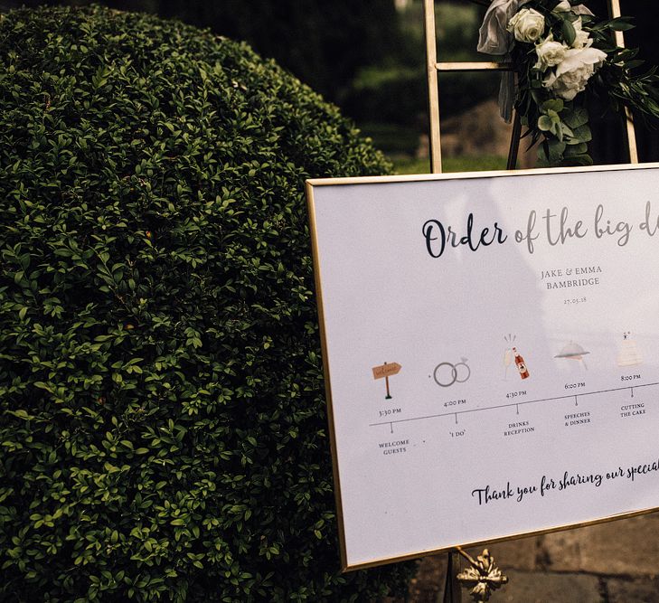 Order of The Day Wedding Sign in Gold Frame | Stylish Tuscan Wedding at Vignamaggio Planned by The Wedding Boutique Italy | Samuel Docker Photography | Paul Vann Films