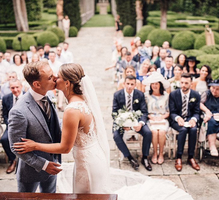 Outdoor Wedding Ceremony | Bride in Pronovias Wedding Dress | Groom in Light Blue Suit Supply Suit | Stylish Tuscan Wedding at Vignamaggio Planned by The Wedding Boutique Italy | Samuel Docker Photography | Paul Vann Films