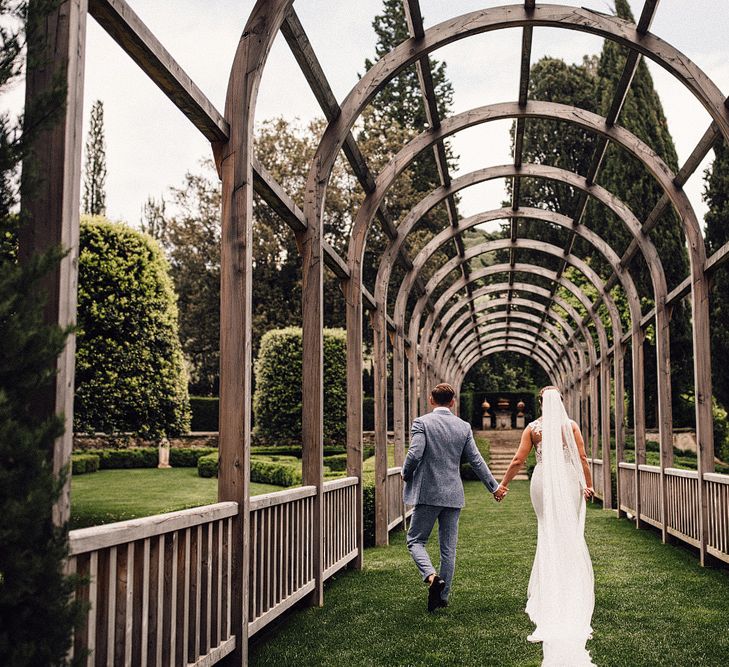 Bride in Pronovias Wedding Dress | Groom in Light Blue Suit Supply Suit | Stylish Tuscan Wedding at Vignamaggio Planned by The Wedding Boutique Italy | Samuel Docker Photography | Paul Vann Films