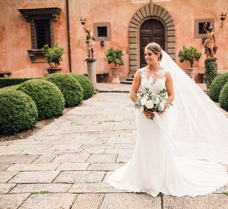 Beautiful Bride in Lace Pronovias Wedding Dress &amp; Veil with White Peony Bouquet | Stylish Tuscan Wedding at Vignamaggio Planned by The Wedding Boutique Italy | Samuel Docker Photography | Paul Vann Films