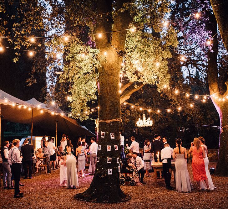 Outdoor Festoon Light Reception | Stylish Tuscan Wedding at Vignamaggio Planned by The Wedding Boutique Italy | Samuel Docker Photography | Paul Vann Films