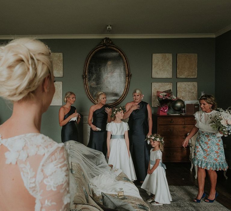 Bridal party see bride in Suzanne Neville wedding dress for first time