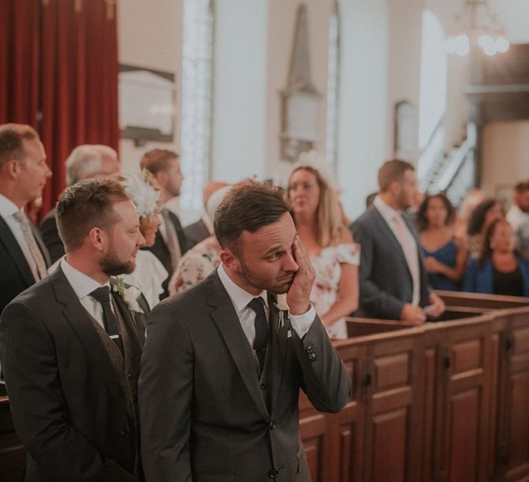 Emotional groom as he waits for bride