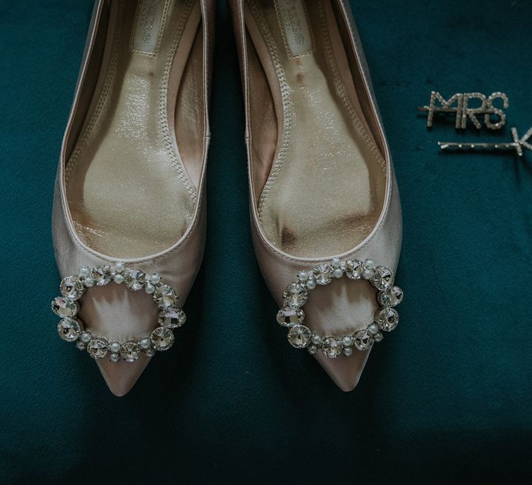 Blush wedding shoes and personalised hair slides with Suzanne Neville wedding dress