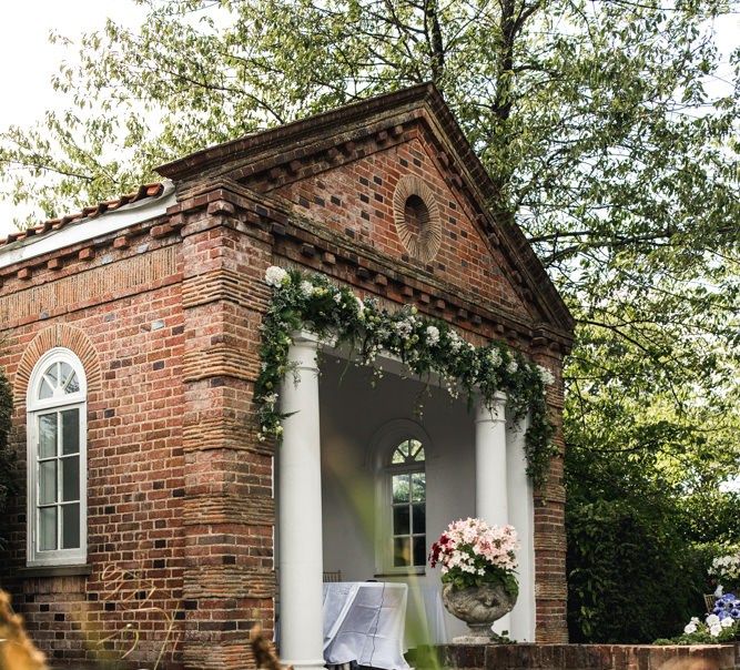 Outdoor wedding ceremony by a pond