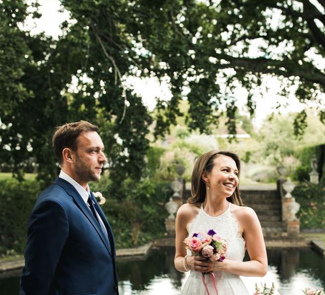 Bride in lace halterneck wedding dress