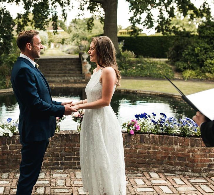 Bride and groom exchanging vows at intimate wedding