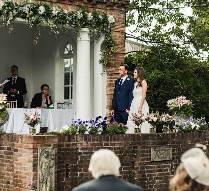 Bride and groom exchanging vows at Micklefield Hall micro wedding