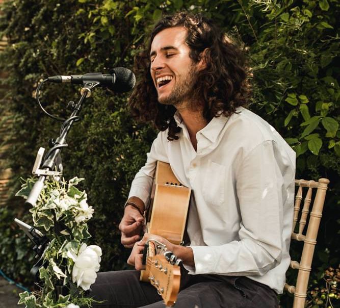 Singer and guitarist at micro wedding