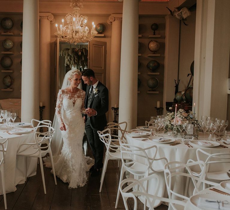 Bride in Suzanne Neville wedding dress with groom