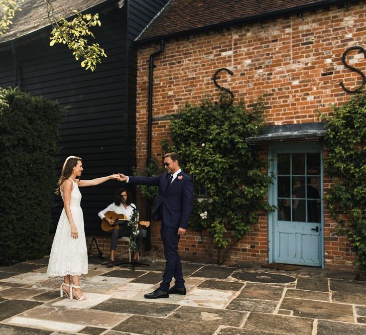 Bride and groom first dance at outdoor Micklefield Hall wedding reception