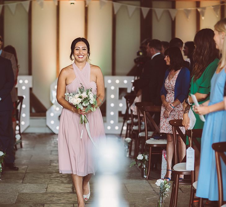 Bridesmaids In Pale Pink Dresses // Brookfield Barn Wedding Venue With Rustic Styling And Bride In Enzoani With Images From Lemonade Pictures And Film By Kitebox Films