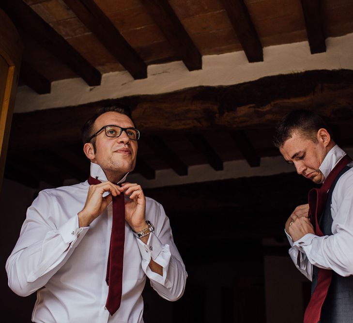 Groom's morning preparations. Destination wedding in Italy. Featuring RMW The List recommended suppliers Wiskow &amp; White and Red on Blonde. Rue de Seine wedding gown with deep red chianti bridesmaid Rewritten dresses.