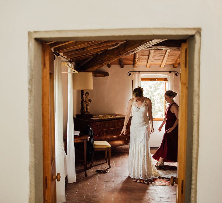 Brides morning preparation. Destination wedding in Italy. Featuring RMW The List recommended suppliers Wiskow &amp; White and Red on Blonde. Rue de Seine wedding gown with deep red chianti bridesmaid Rewritten dresses.