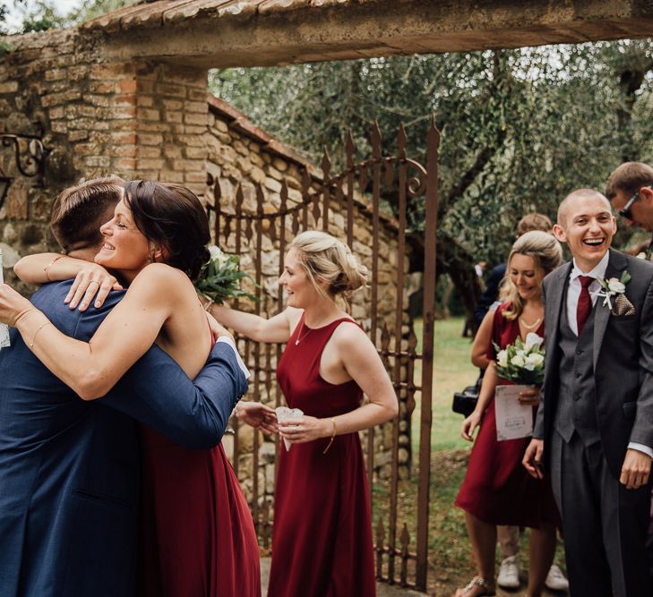 Destination wedding in Italy. Featuring RMW The List recommended suppliers Wiskow &amp; White and Red on Blonde. Rue de Seine wedding gown with deep red chianti bridesmaid Rewritten dresses.