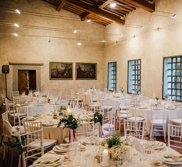 Table Decor, white on white. Destination wedding in Italy. Featuring RMW The List recommended suppliers Wiskow &amp; White and Red on Blonde. Rue de Seine wedding gown with deep red chianti bridesmaid Rewritten dresses.