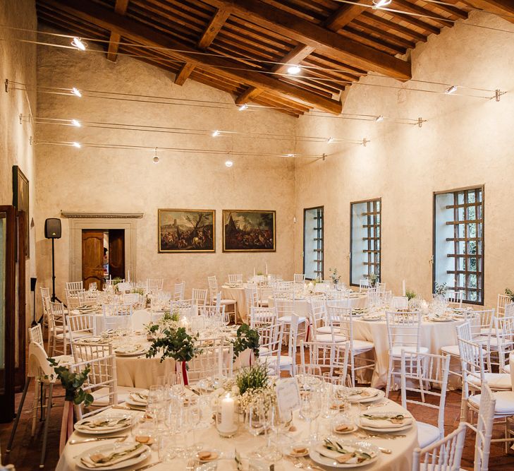 Table Decor, white on white. Destination wedding in Italy. Featuring RMW The List recommended suppliers Wiskow &amp; White and Red on Blonde. Rue de Seine wedding gown with deep red chianti bridesmaid Rewritten dresses.