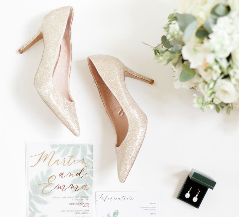 Gold glitter wedding shoes and wedding stationery