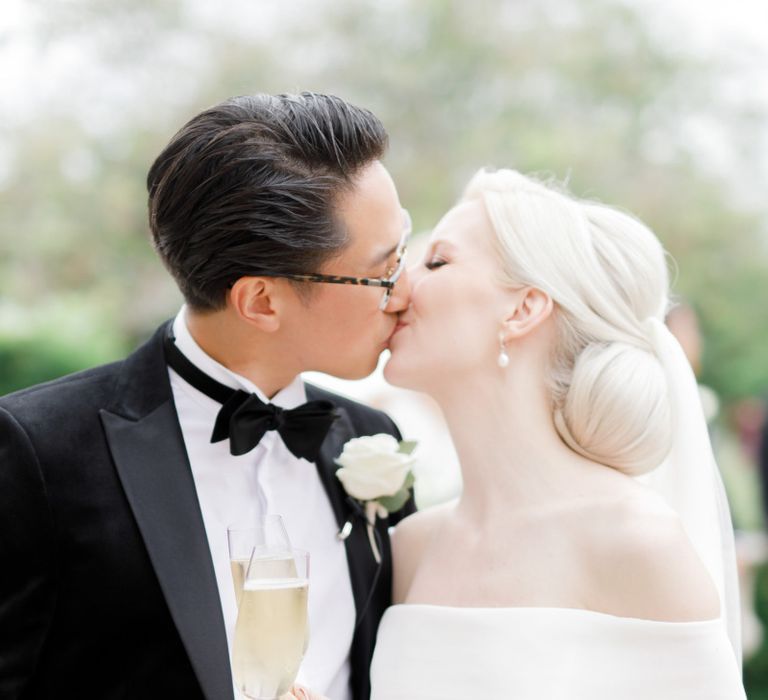 Bride and groom kissing at Froyle Park wedding