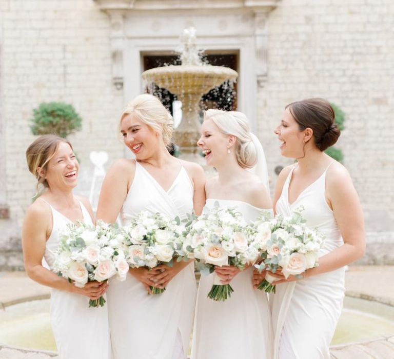 Bridal party with bridesmaids in white dresses