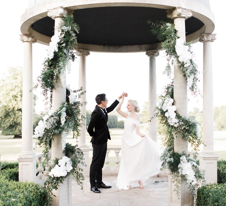 Bride and groom portrait at outdoor dome at Froyle Park