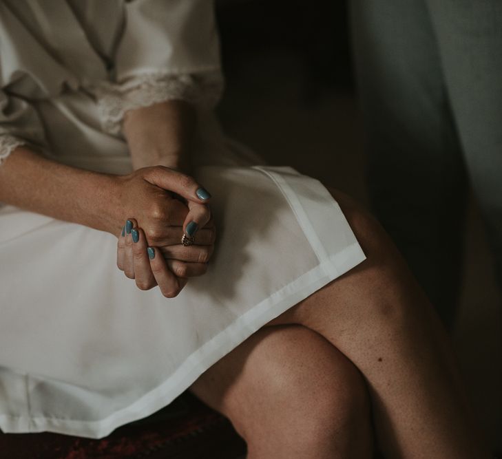 Bride in Getting Ready Robe with Blue Nail Polish