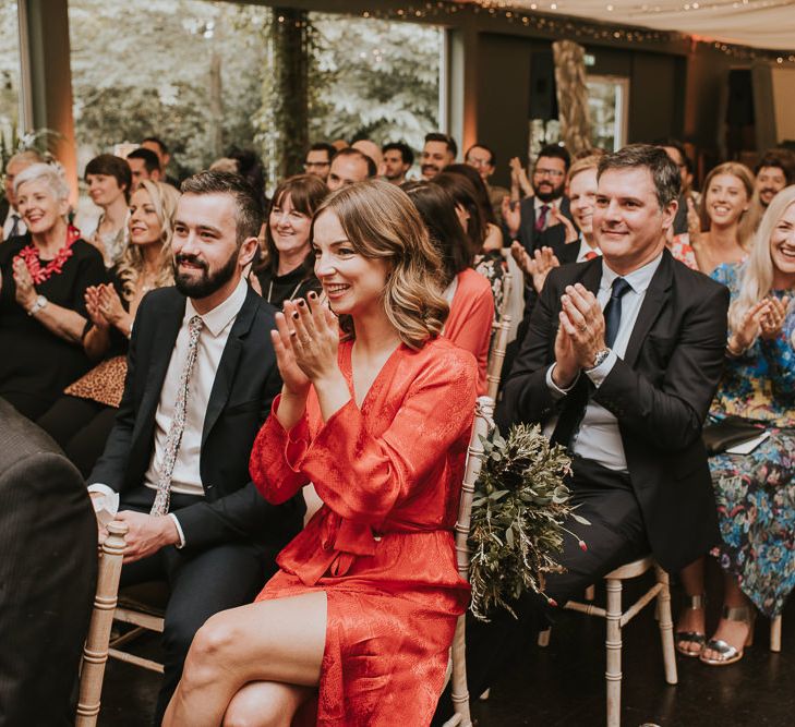 Wedding Guests Clapping During The Wedding Ceremony