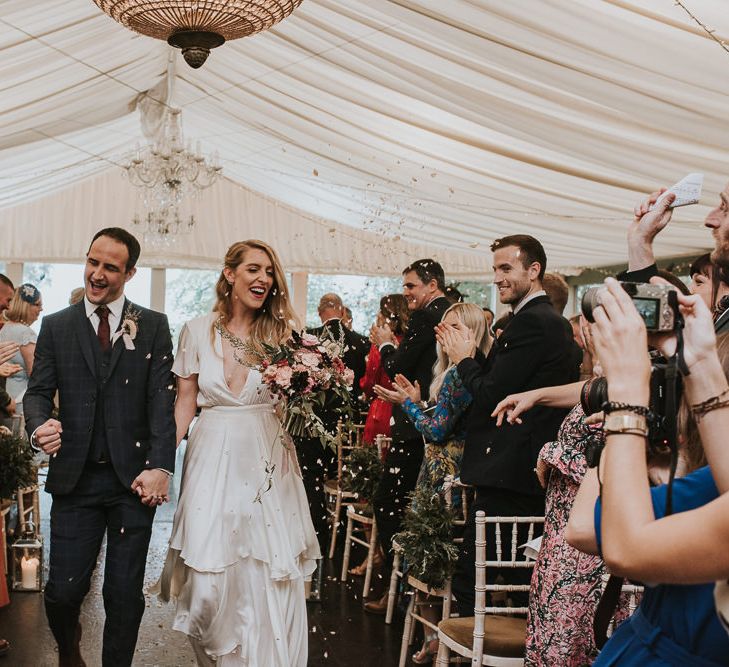 Bride in Houghton NYC Wedding Dress and Groom Check Suit Just Married Showered in Confetti