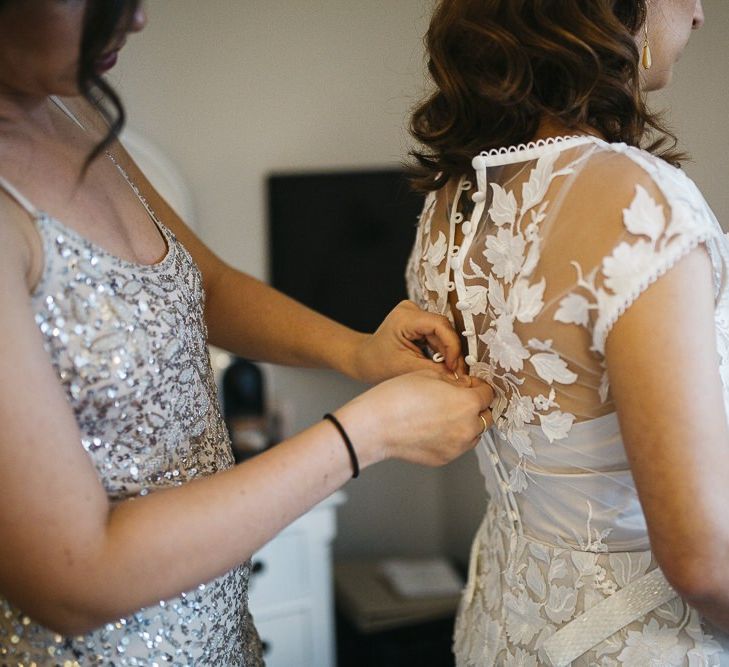 Bride wearing Phase Eight Wedding Dress with her bridesmaid in embellished dress