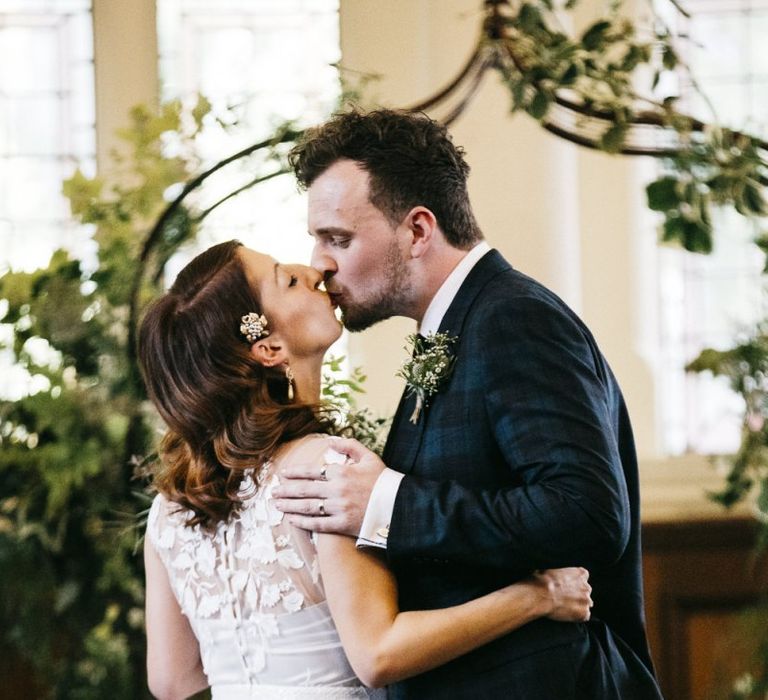 Bride wearing Phase Eight Wedding Dress and embellished hair accessory