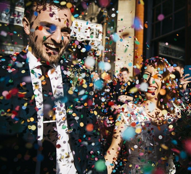 Bride and groom confetti shot at autumn celebration in London