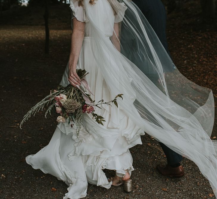 Bride in Tiered Houghton NYC Wedding Dress and Wedding Veil