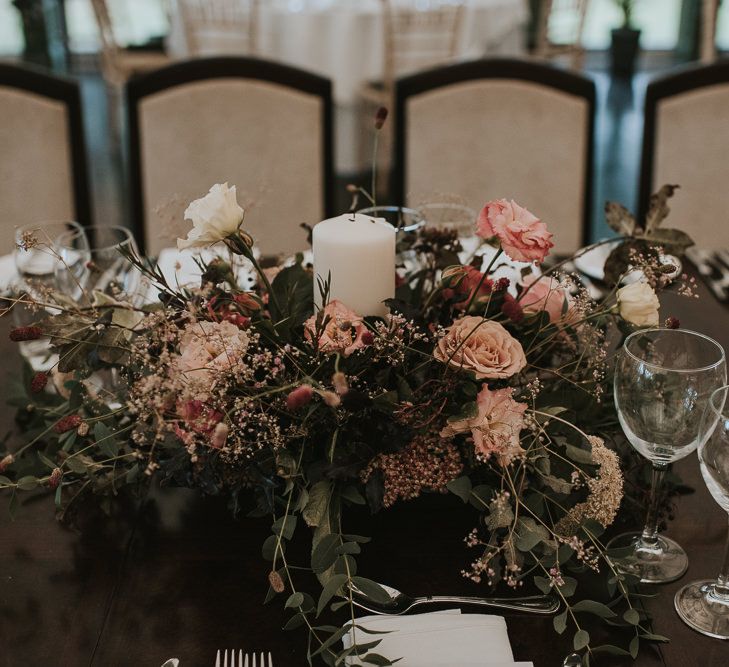 Floral Centrepiece with Church Candle and Pink Flowers