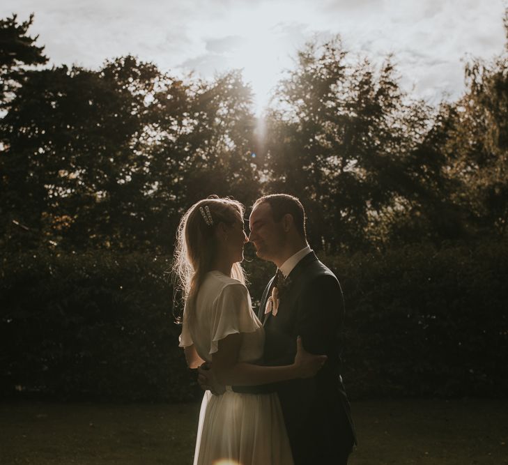 Golden Hour Portrait with Bride in Tiered Houghton NYC Wedding Dress and Groom in Check House of Fraser Suit