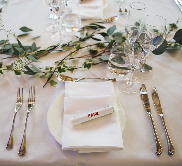 Table styling with personalised Love Heart place settings and foliage decor