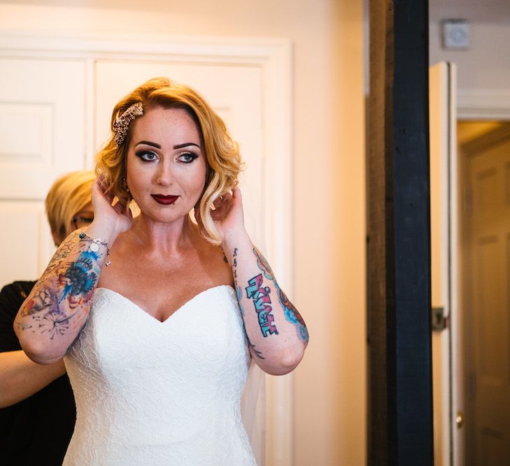 Wedding Morning Preparations | Bride in Strapless Sassi Holford Wedding Dress with Sweetheart Neckline | Edison Bulb Floral Installation at Kingsthorpe Lodge Barn Wedding | Johnny Dent Photography