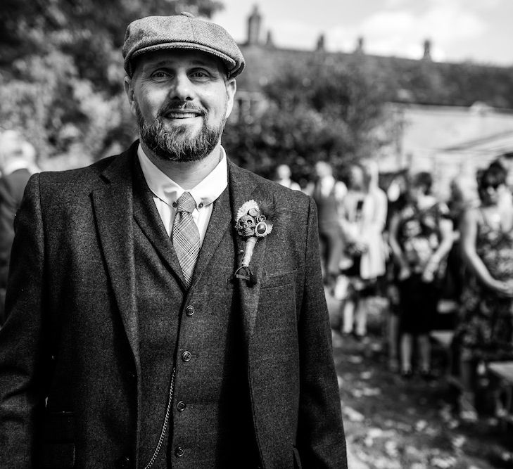 Wedding Ceremony | Groom in Burgundy Tweed Three Piece Suit | Edison Bulb Floral Installation at Kingsthorpe Lodge Barn Wedding | Johnny Dent Photography