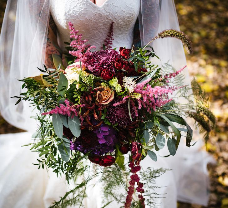 Bright Bouquet | Bride in Strapless Sassi Holford Wedding Dress with Sweetheart Neckline | Edison Bulb Floral Installation at Kingsthorpe Lodge Barn Wedding | Johnny Dent Photography