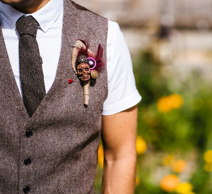 Tweed Waistcoat with Skull &amp; Feather Buttonhole | Edison Bulb Floral Installation at Kingsthorpe Lodge Barn Wedding | Johnny Dent Photography