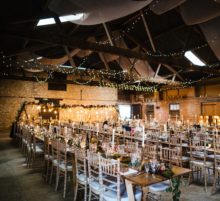 Wedding Reception Decor | Banquet Tables | Festoon Lights | Edison Bulb Floral Installation at Kingsthorpe Lodge Barn Wedding | Johnny Dent Photography