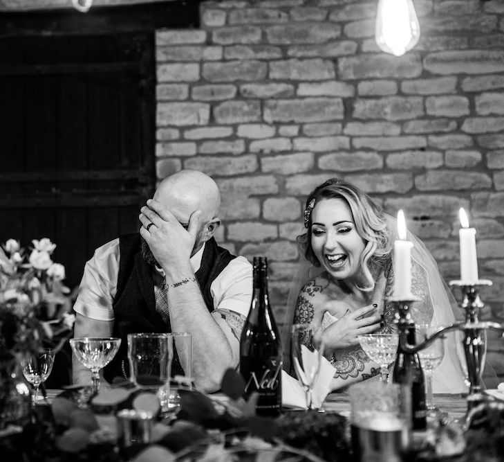 Wedding Reception | Bride in Strapless Sassi Holford Wedding Dress with Sweetheart Neckline | Groom in Burgundy Tweed Three Piece Suit | Edison Bulb Floral Installation at Kingsthorpe Lodge Barn Wedding | Johnny Dent Photography