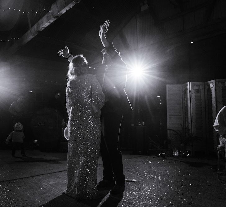 First Dance | Bride in Sequinned Kimono from ASOS | Groom in Burgundy Tweed Three Piece Suit | Edison Bulb Floral Installation at Kingsthorpe Lodge Barn Wedding | Johnny Dent Photography