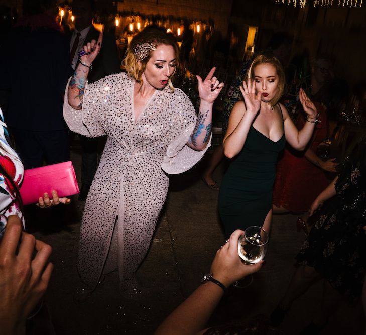 Bride in Sequinned Kimono from ASOS | Edison Bulb Floral Installation at Kingsthorpe Lodge Barn Wedding | Johnny Dent Photography