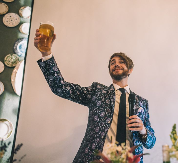 Groom In Patterned Suit Making Toast