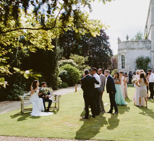 Wedding Guests At Elmore Court // Larkspur &amp; Delphinium Wedding Flowers Elmore Court Gloucestershire Bride Pronovias Calligraphy Pale Press Flowers By The Rose Shed Images David Jenkins