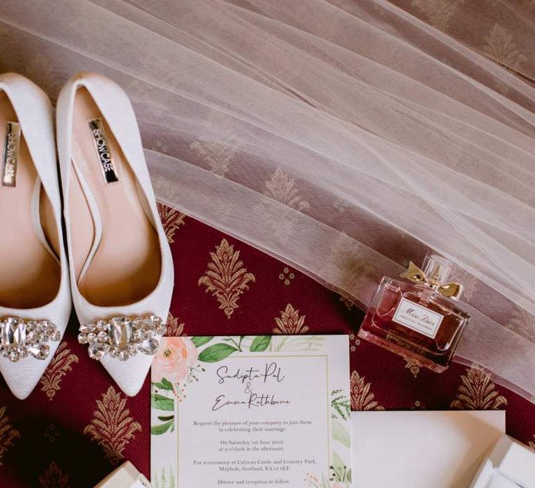 Embellished wedding shoes with wedding stationery