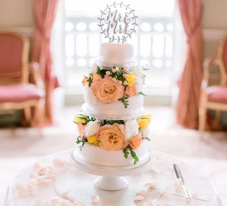 Wedding cake with bright wedding flower decor